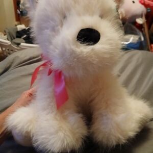 Fluffy White Plush Dog with Pink Ribbon